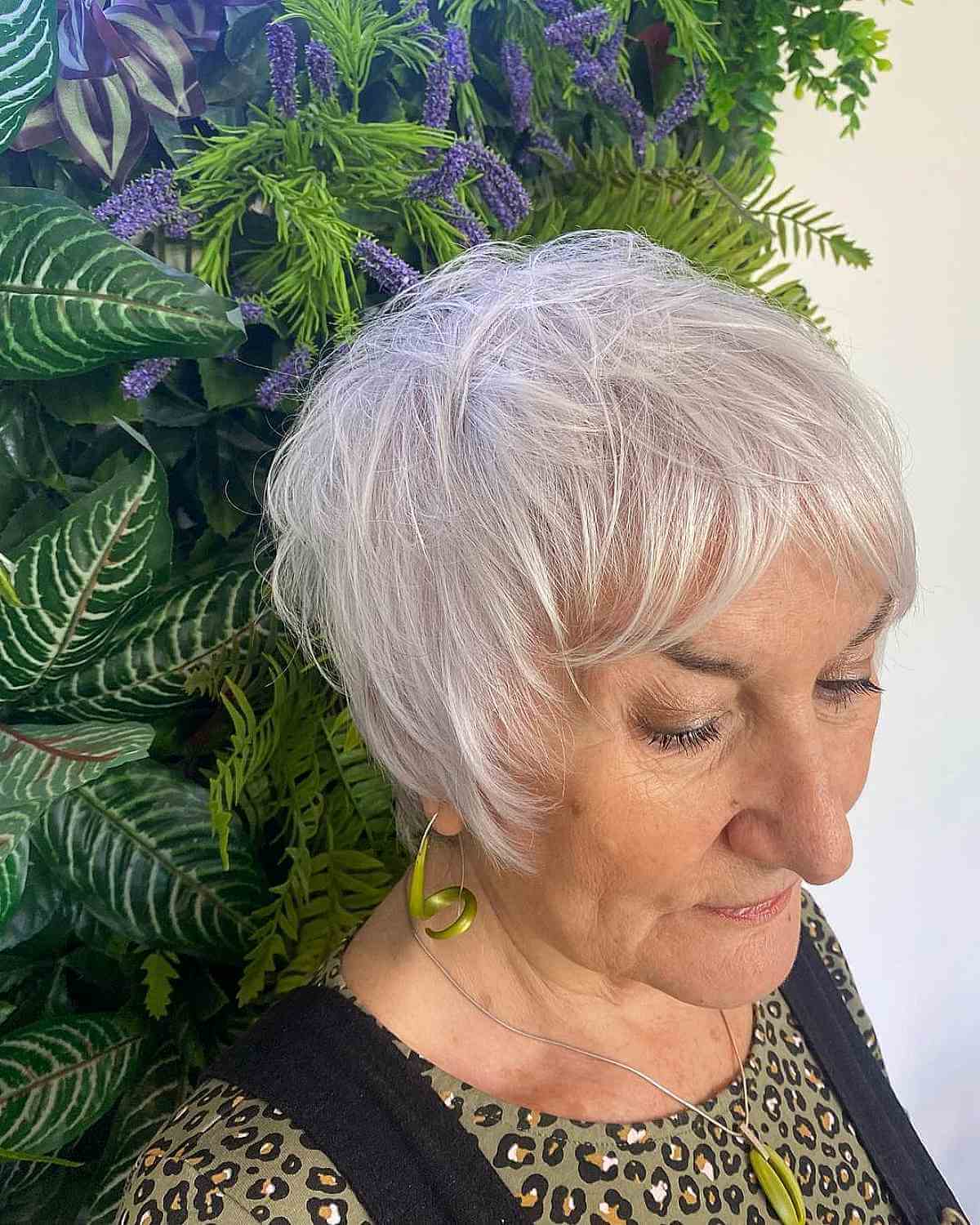 Messy Ear-Length Hair with Curtain Bangs for 70-Year-Old Women