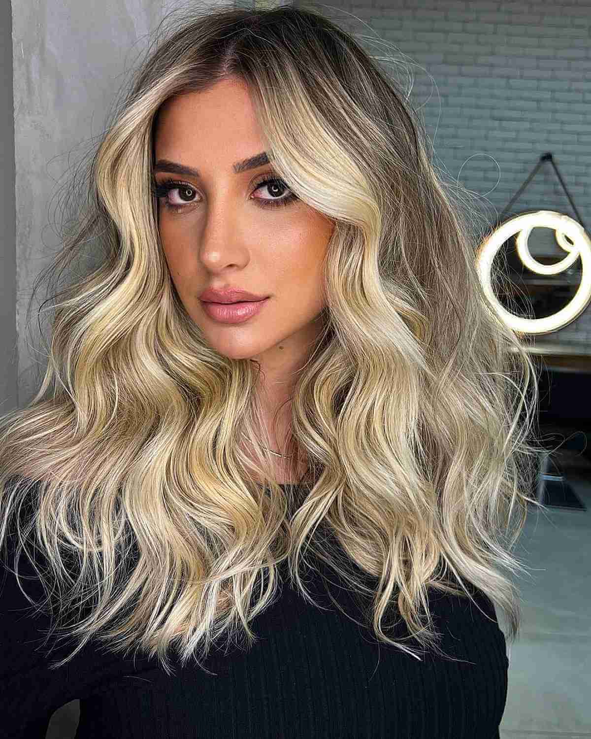 Messy Long Blonde Hair with Dark Brown Roots