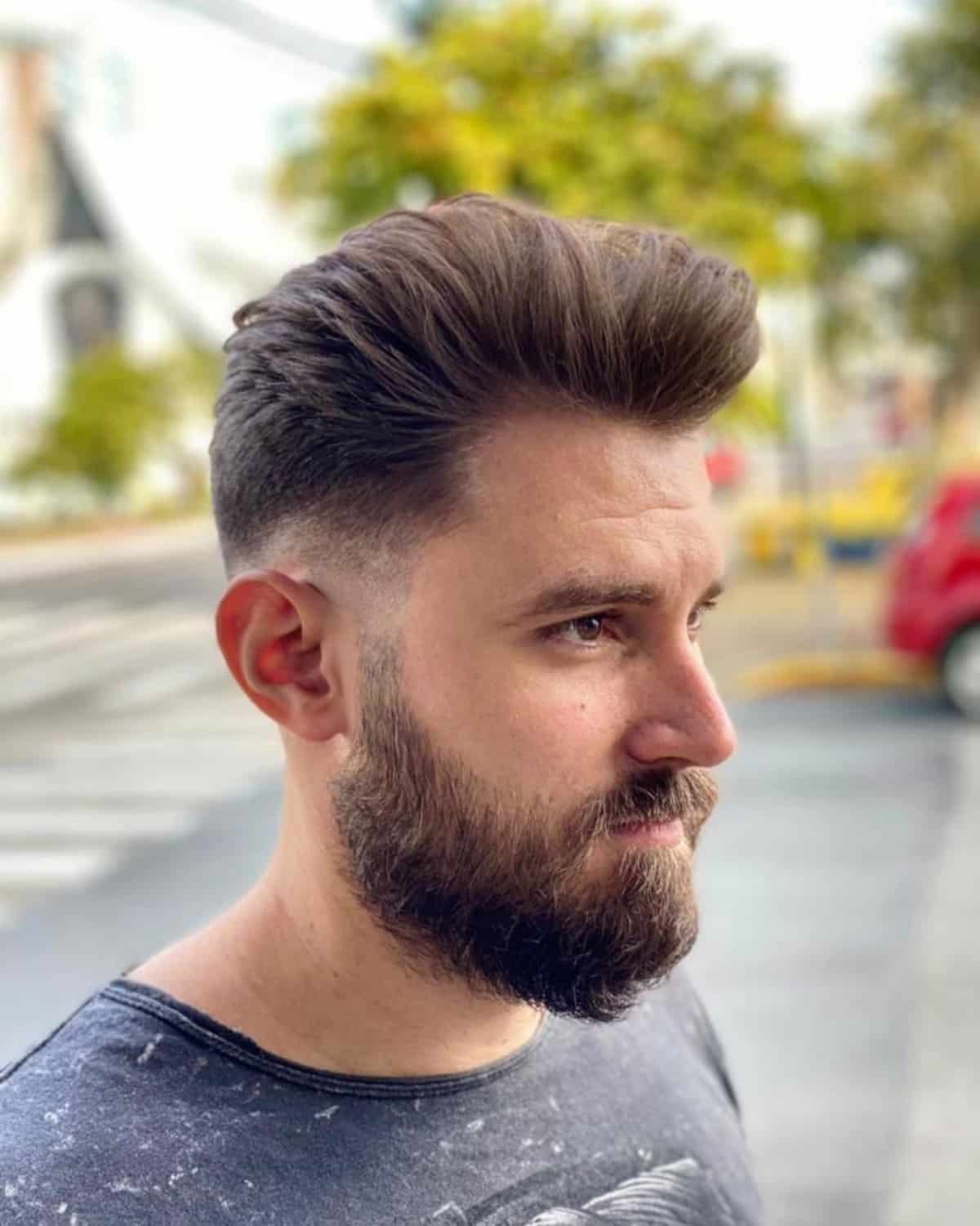 Messy pompadour with low fade