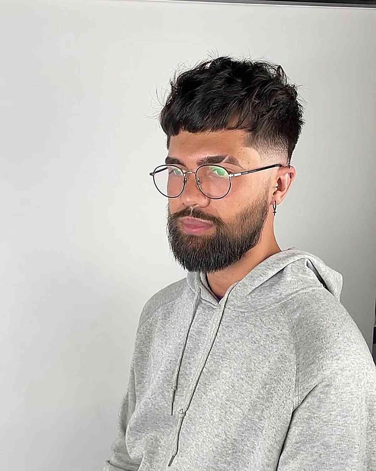 Messy Textured French Crop Fade with Mini Bangs for Men with Specs