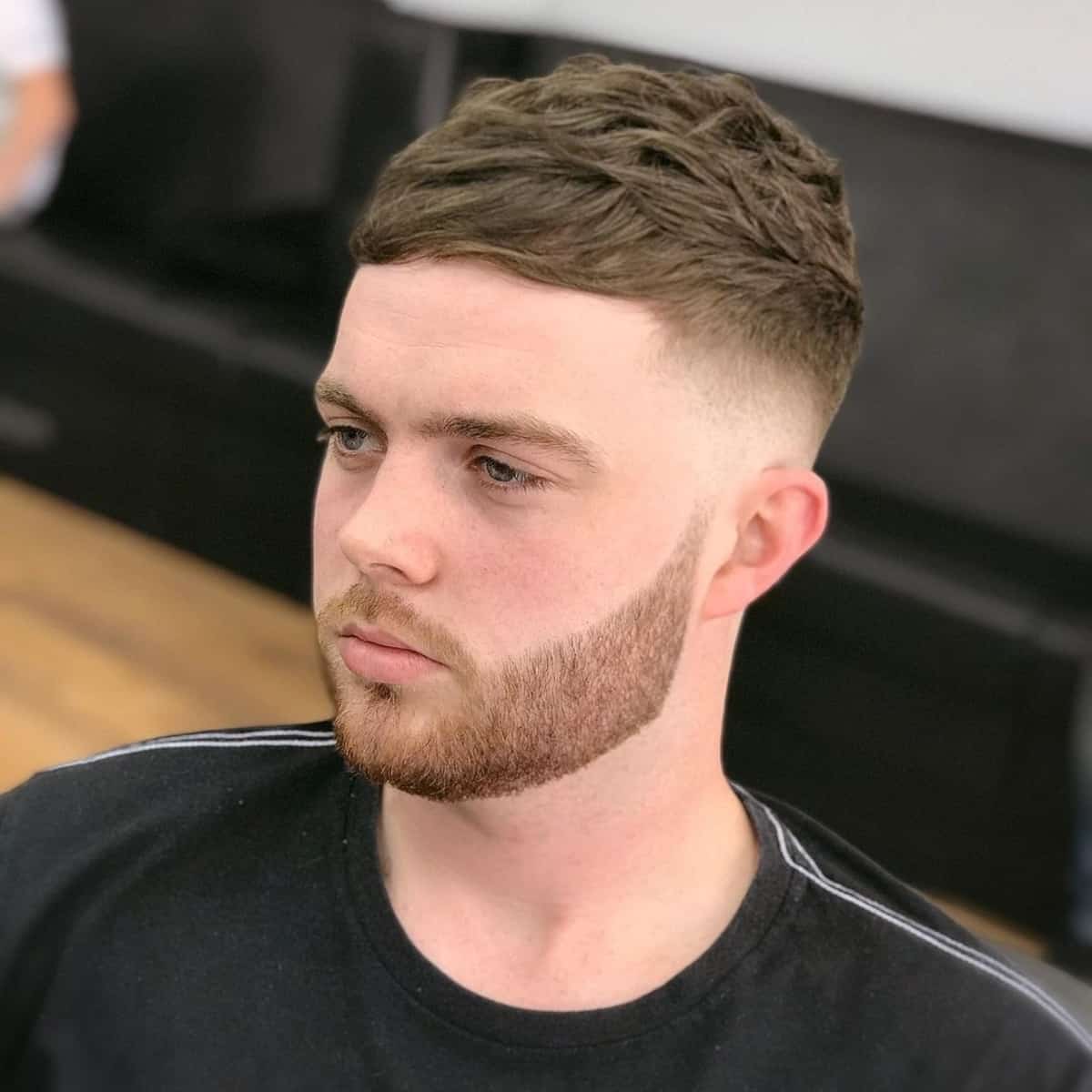 Messy textured french crop with mid fade haircut for guys