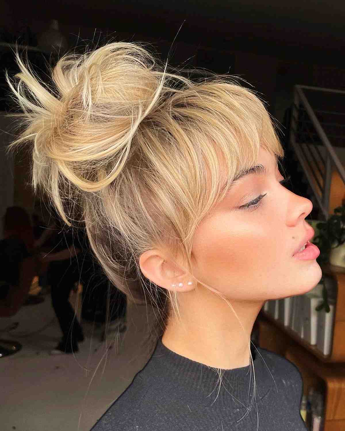 Messy Top Knot Updo with Bangs