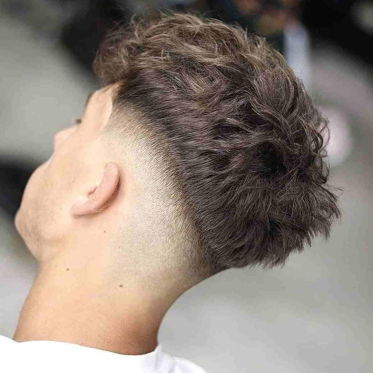 Messy Top with a Sharp Drop Fade
