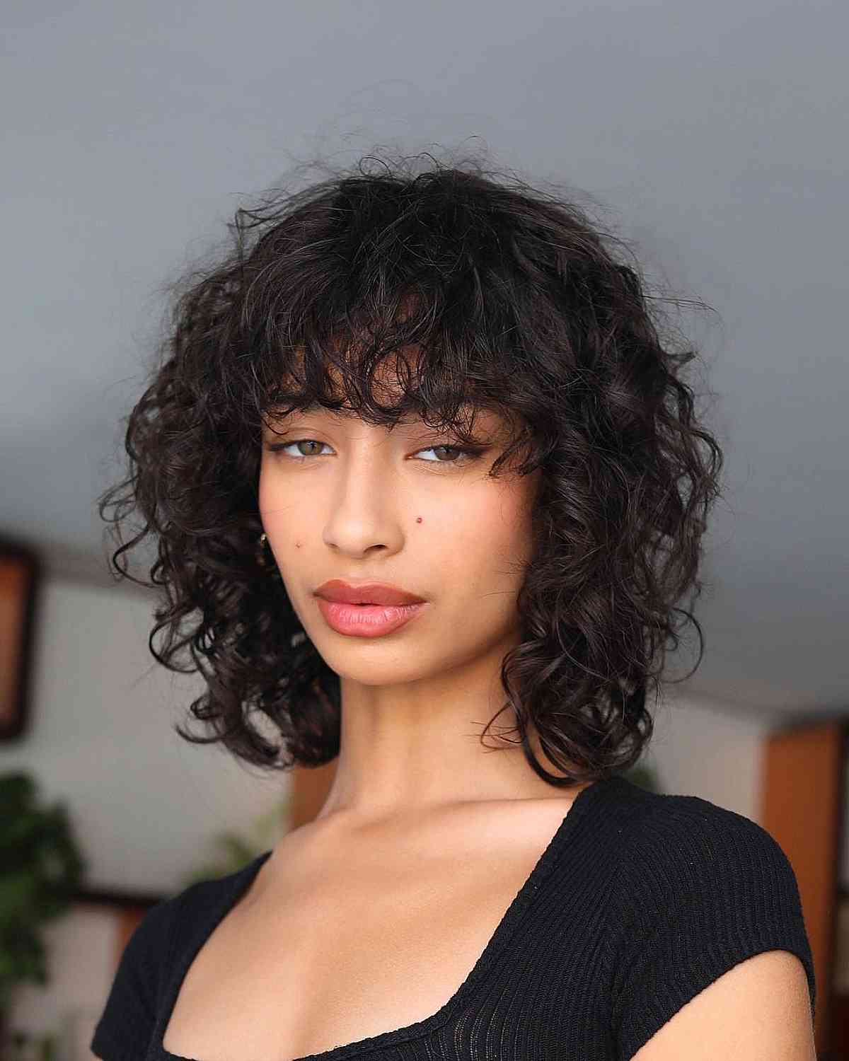 Messy Wet Curls with Thick Bangs