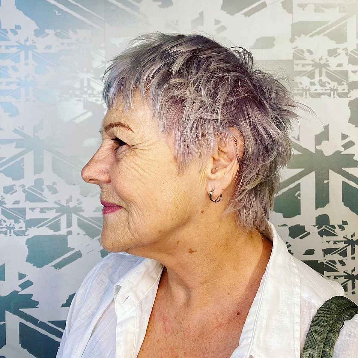 metallic pink spiky pixie for a woman in her 70s