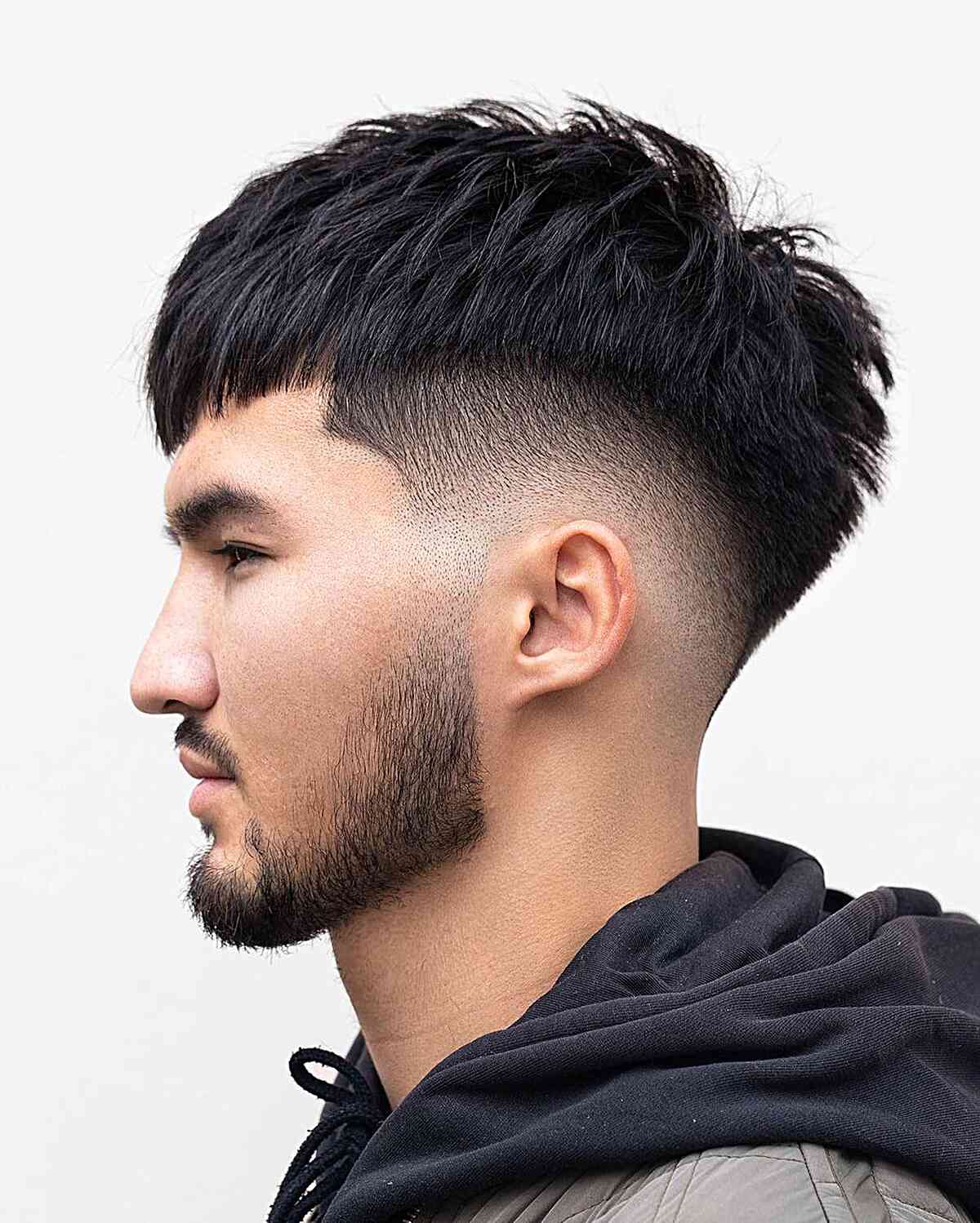 Mid Fade Edgar Cut with Piece-y Texture on Males with Straighter Hair
