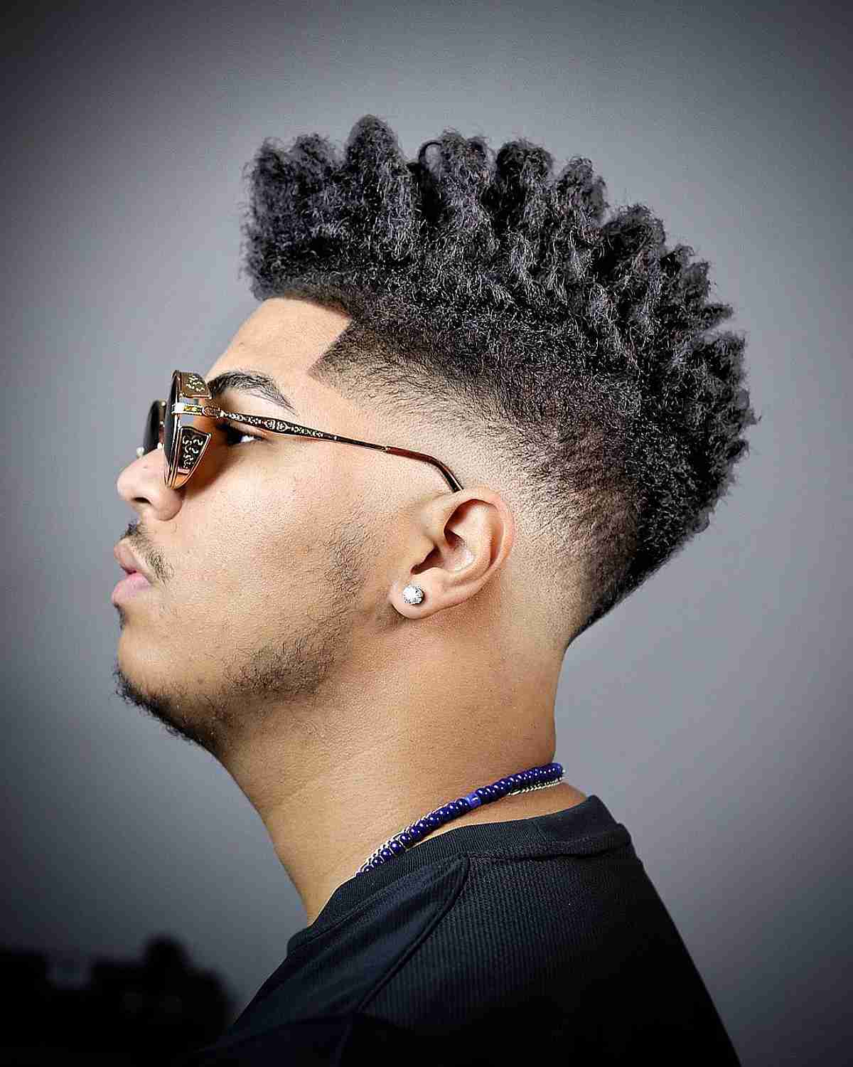 Mid Fade with a Kinky Top for Men