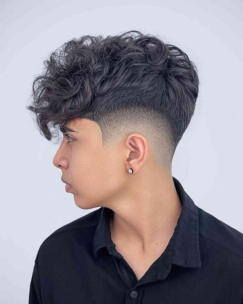 A Mid-Fade with a Long Curly Faux Hawk Top for Teen Boys