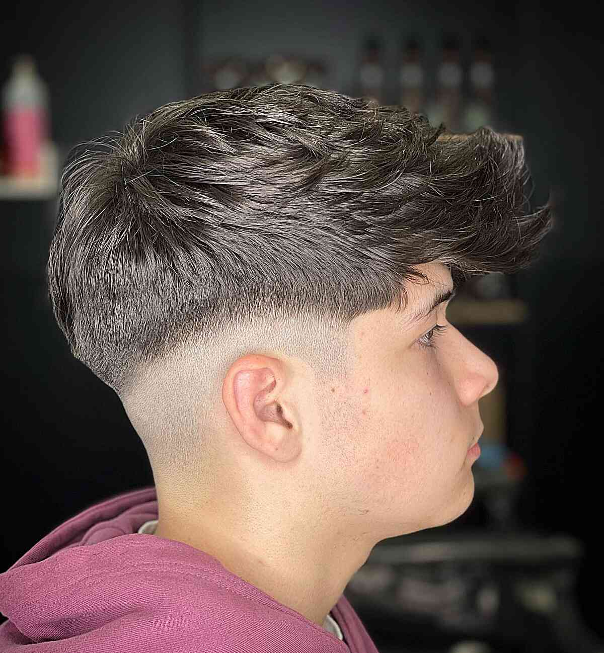 Mid Fade with a Long Fohawk Style for Boys in their Teens