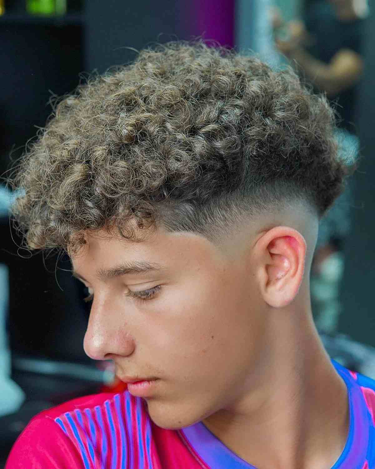 Mid-Faded Curly Hair with a V-Cut for Men