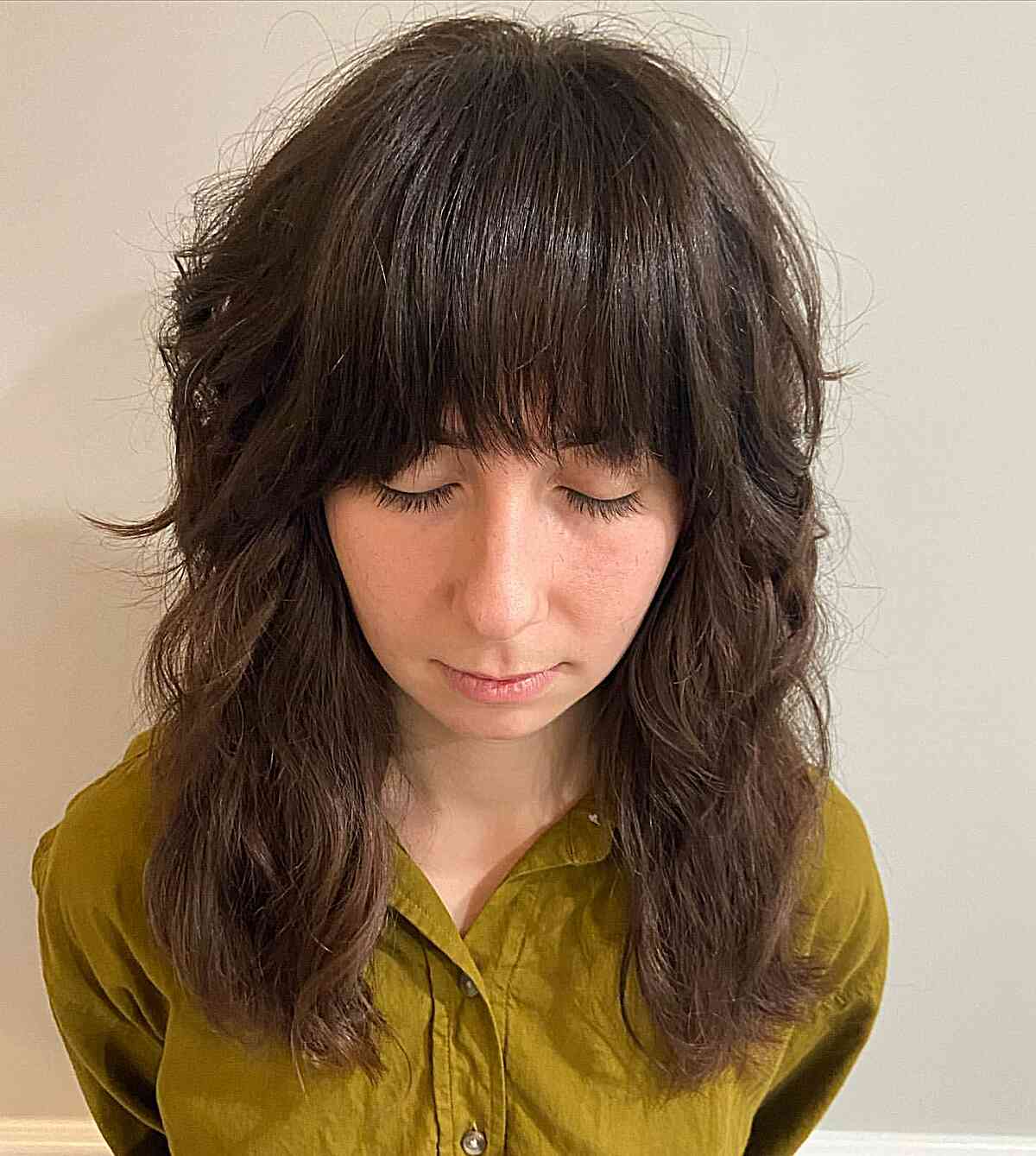 Mid-Length Brunette Shag with Straight, Full Bangs and Shorter Layers for Thick Hair