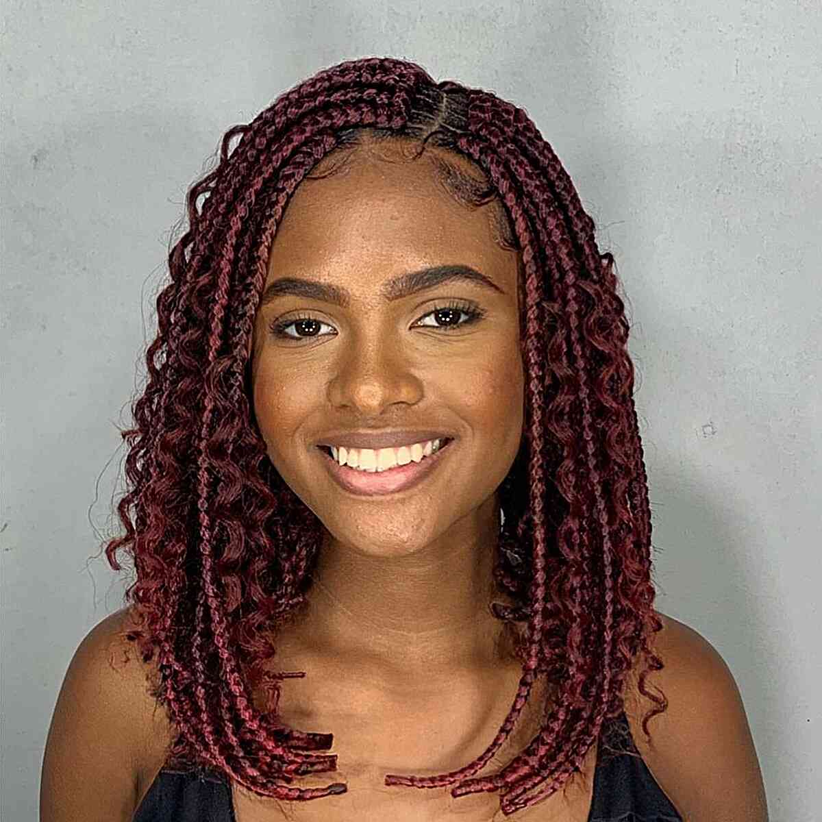 Mid-Length Burgundy Box Braids for black ladies with a side part
