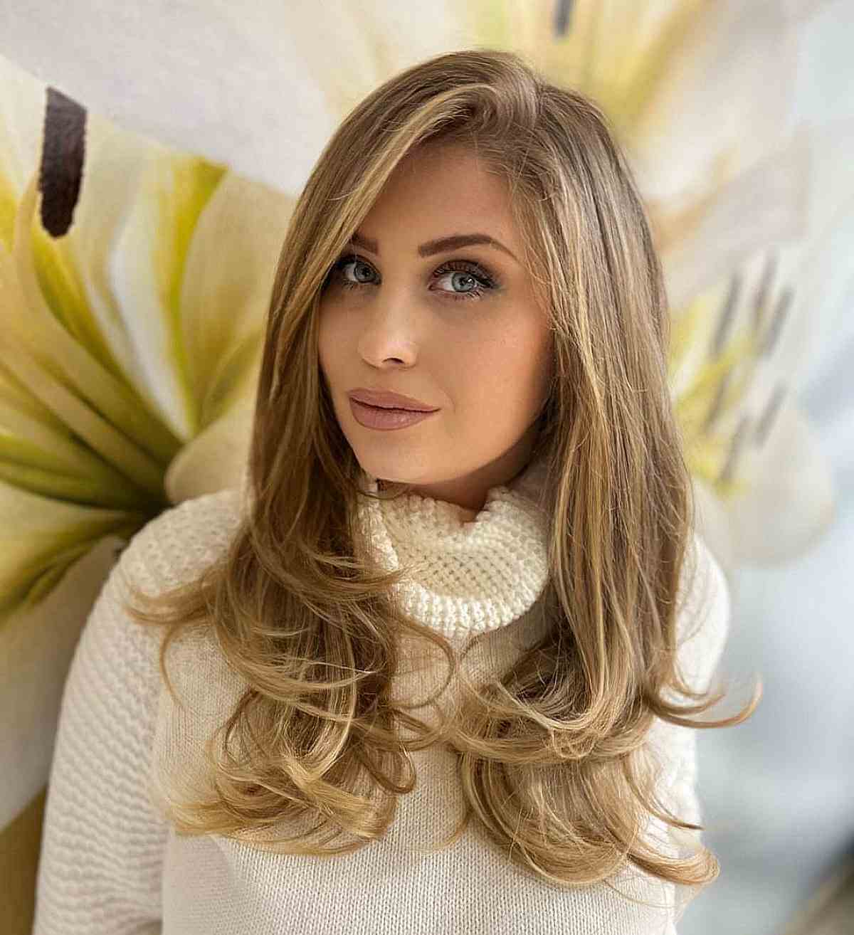 Mid-Length Caramel Blonde Cut with a Deep Side Part 