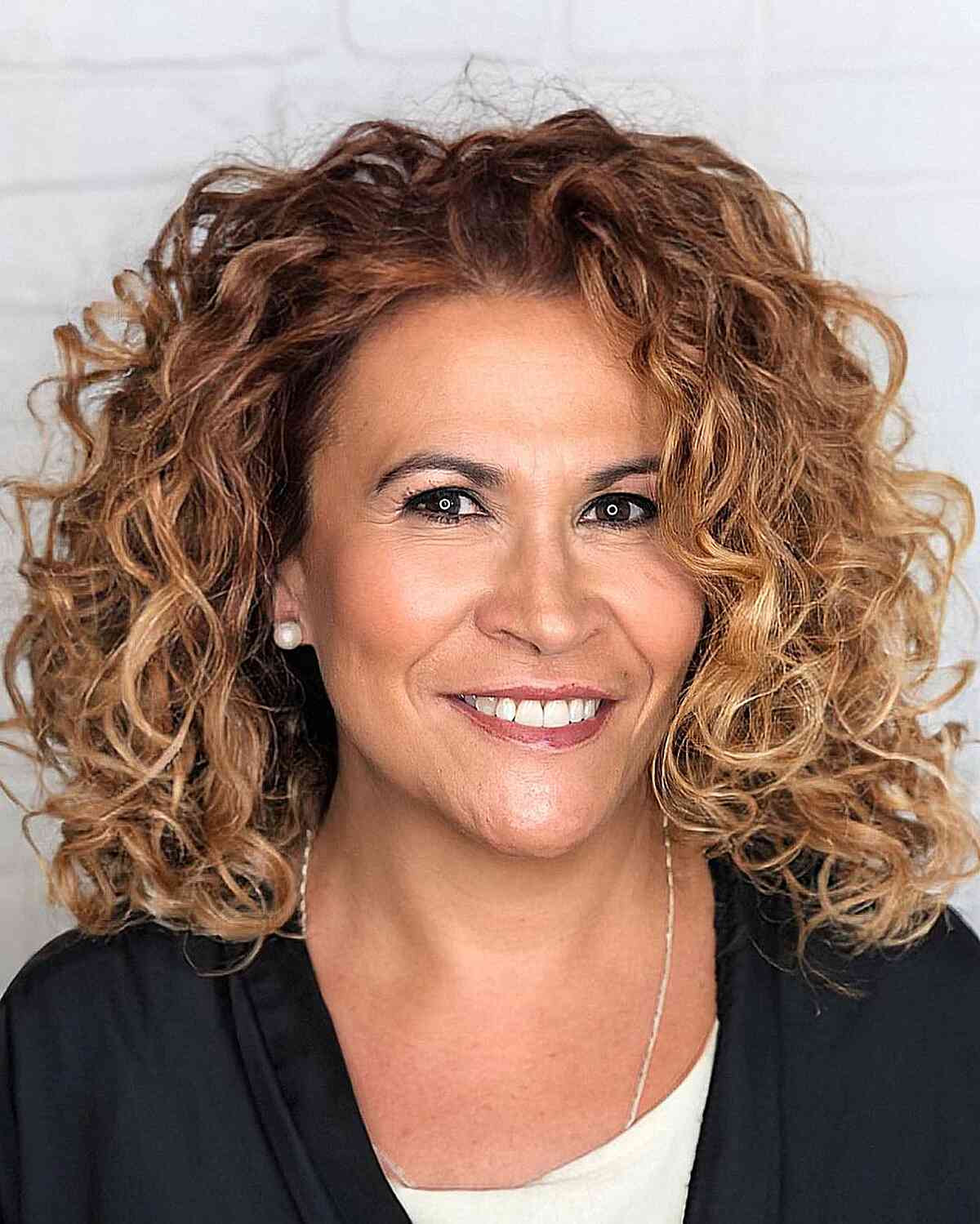 Mid-Length Caramel Brown Curls for Women Aged 40