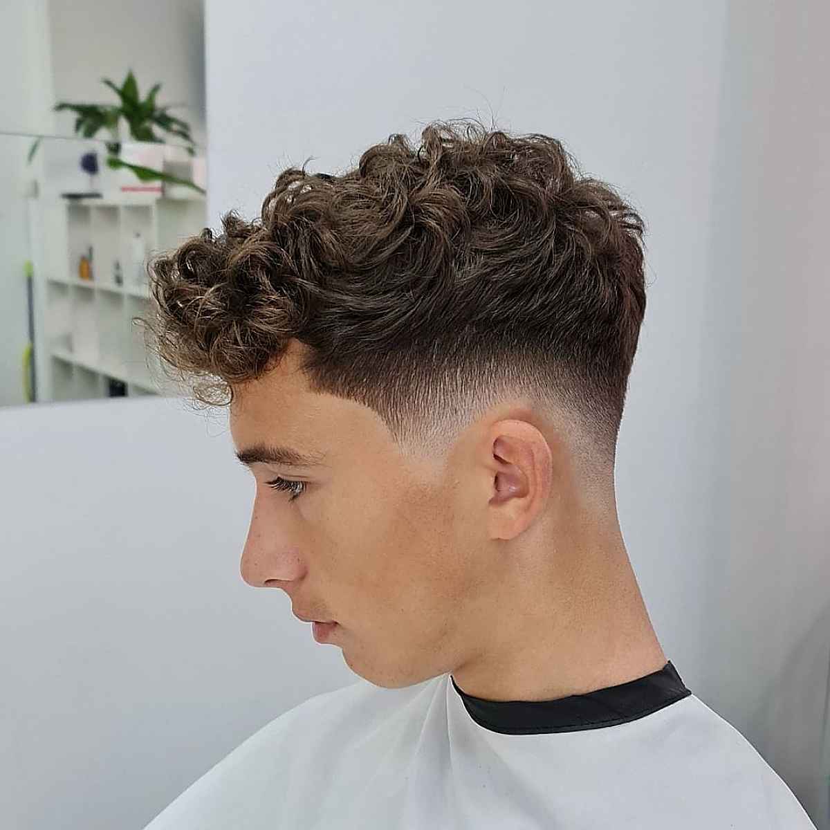 mid-length curly strands with mid fade