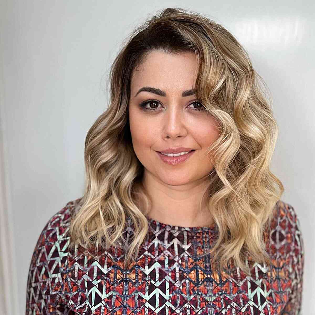 Mid-Length Dark Rooted Blonde Loose Curls for Round Faces