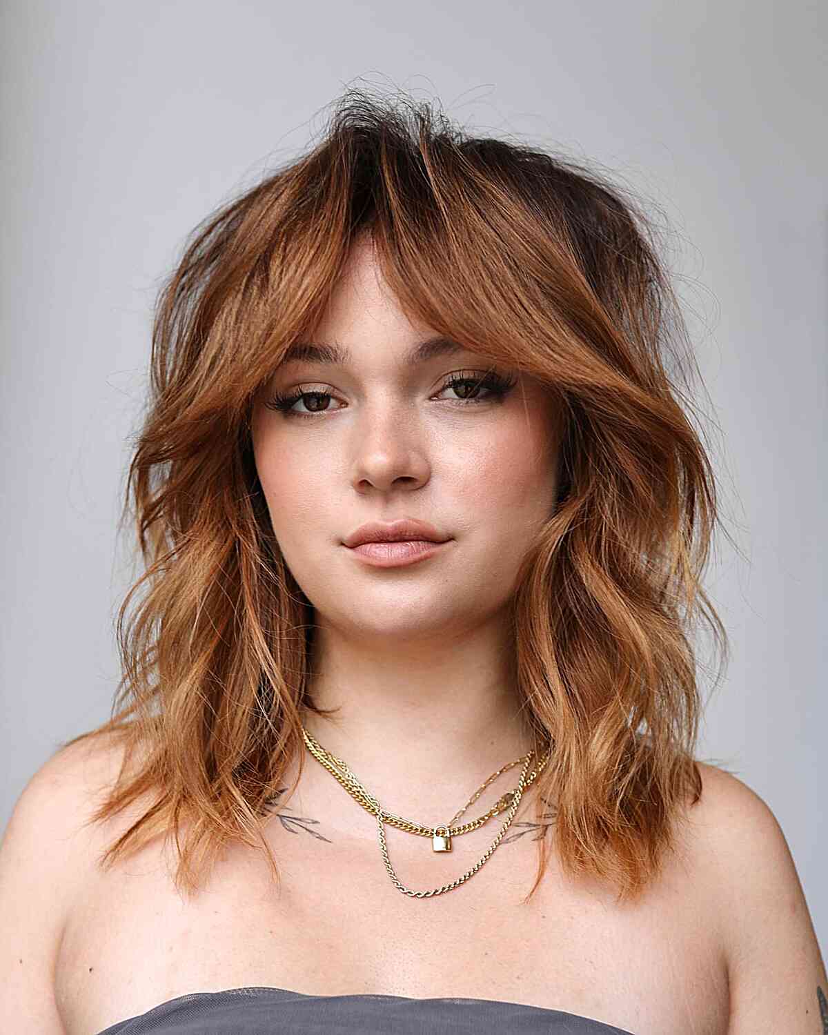 Mid-Length Dimensional Copper Curtain Fringe for messy layered hair