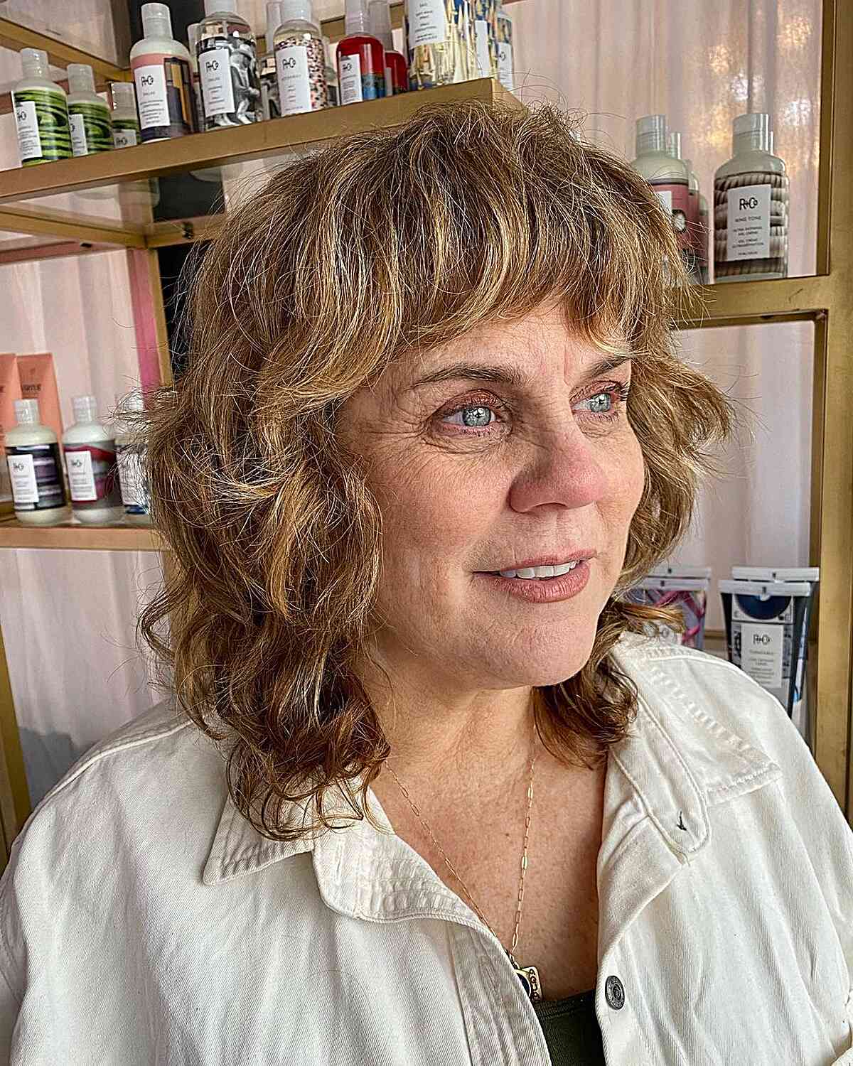 Mid-Length Layered Wavy Shag Style with Wavy Bangs for Women Over 60
