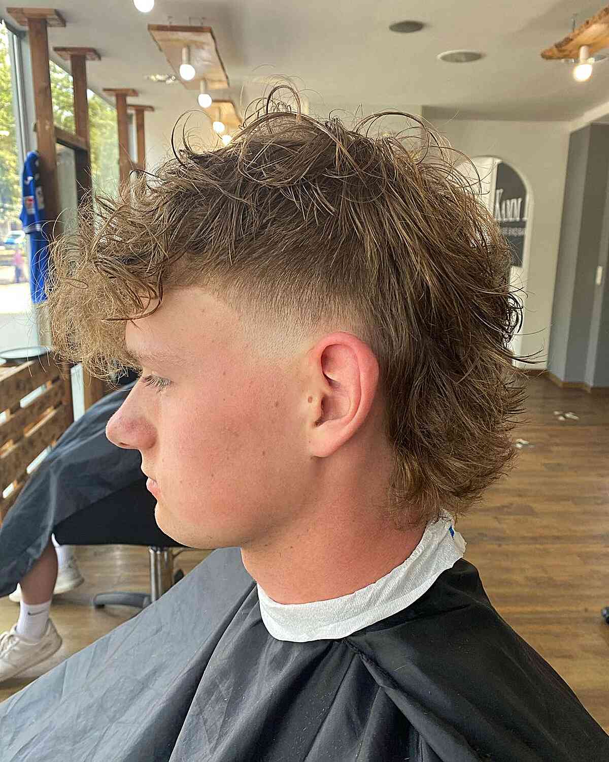 Mid-Length Messy Mohawk Burst Fade on Young Men