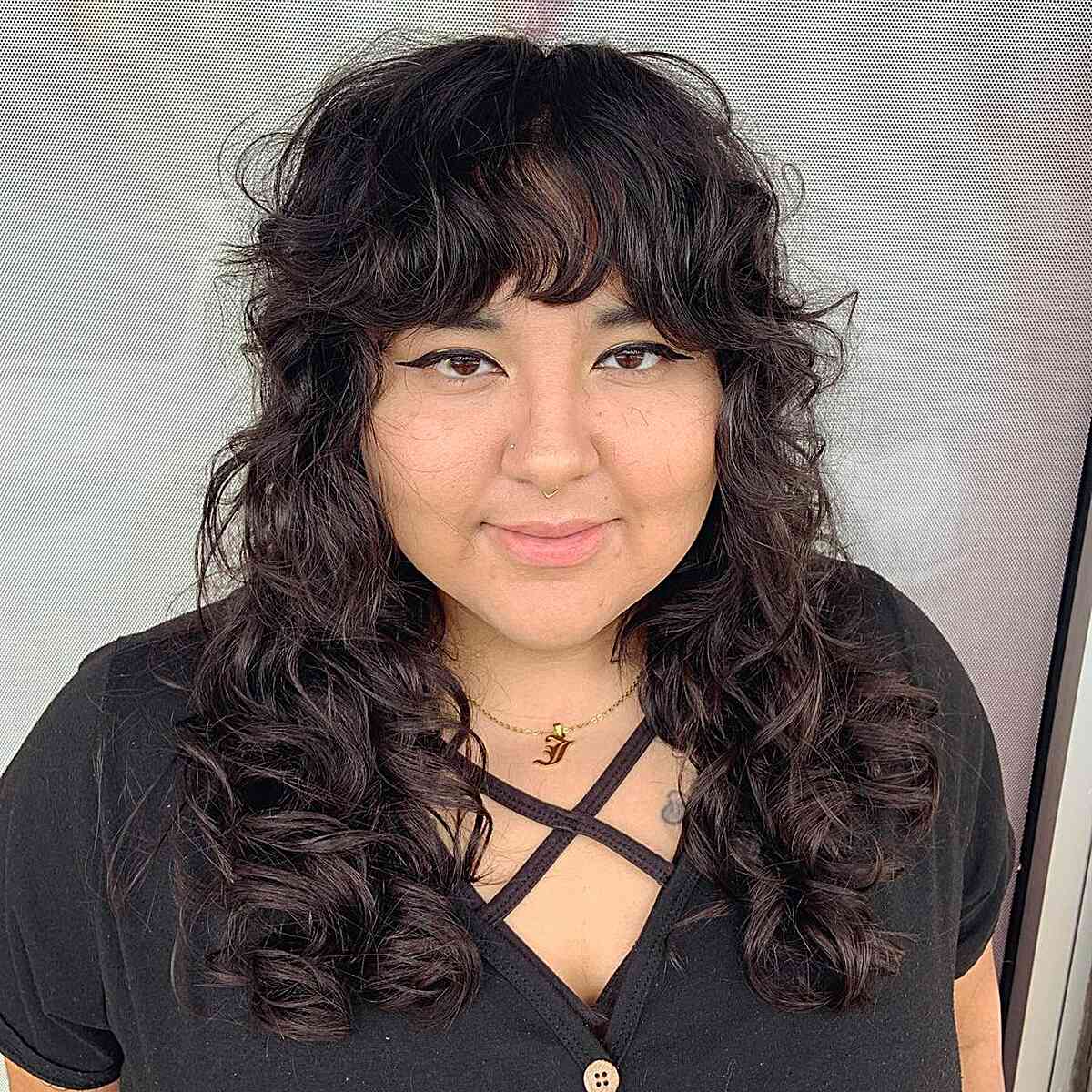 Mid-Length Messy Shag for Curly Hair with Bangs for Round Faces