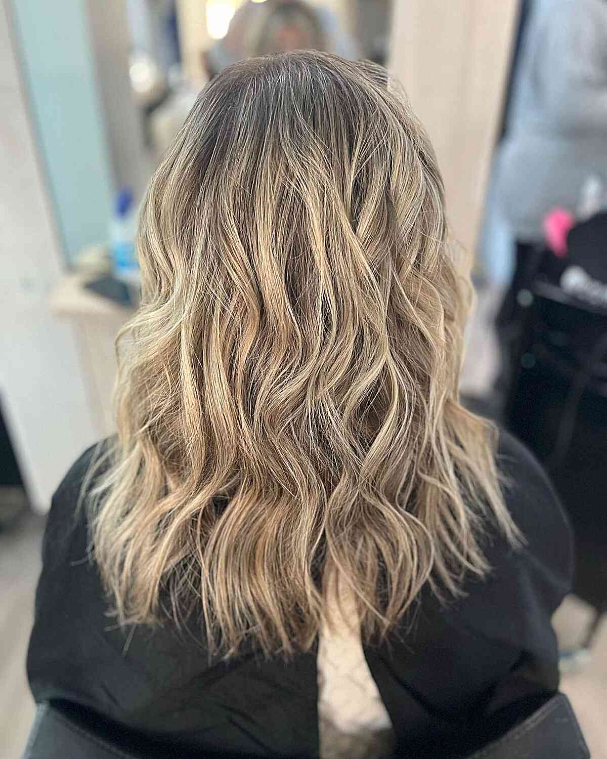 Mid-Length Messy Waves on Dirty Neutral Blonde Balayage and Dark Roots