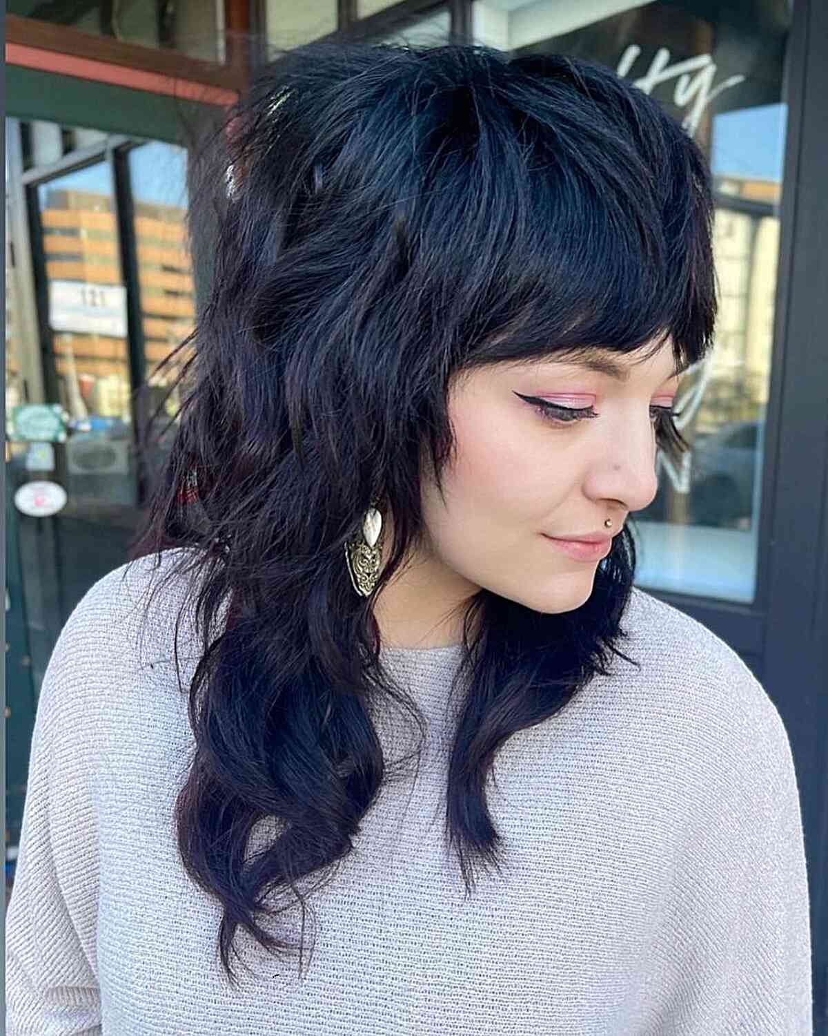 Mid-Length Shag with Big Volume and Bangs for ladies with dark wavy hair
