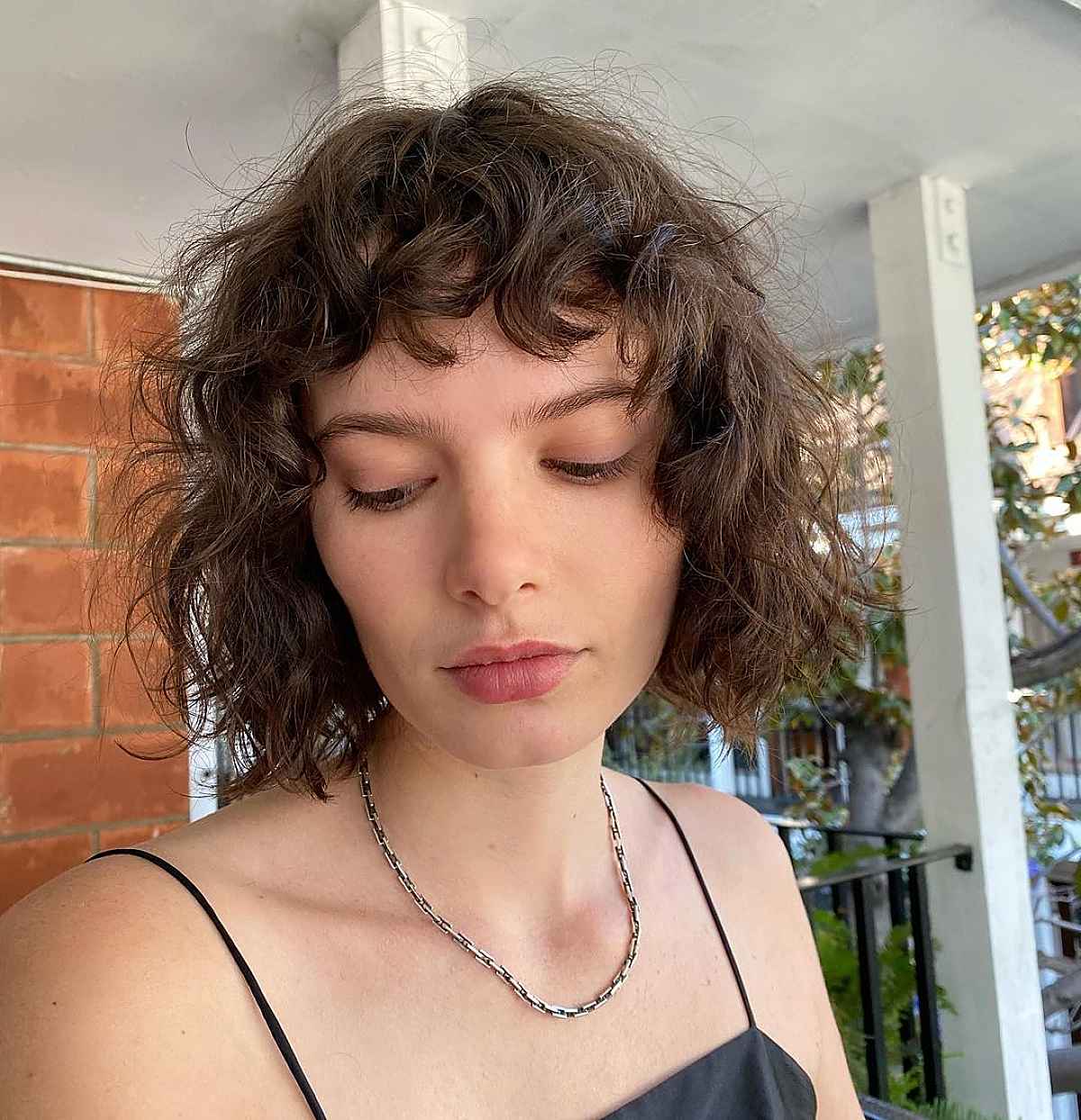 Mid-Length Wavy Bob with Bangs and Layers