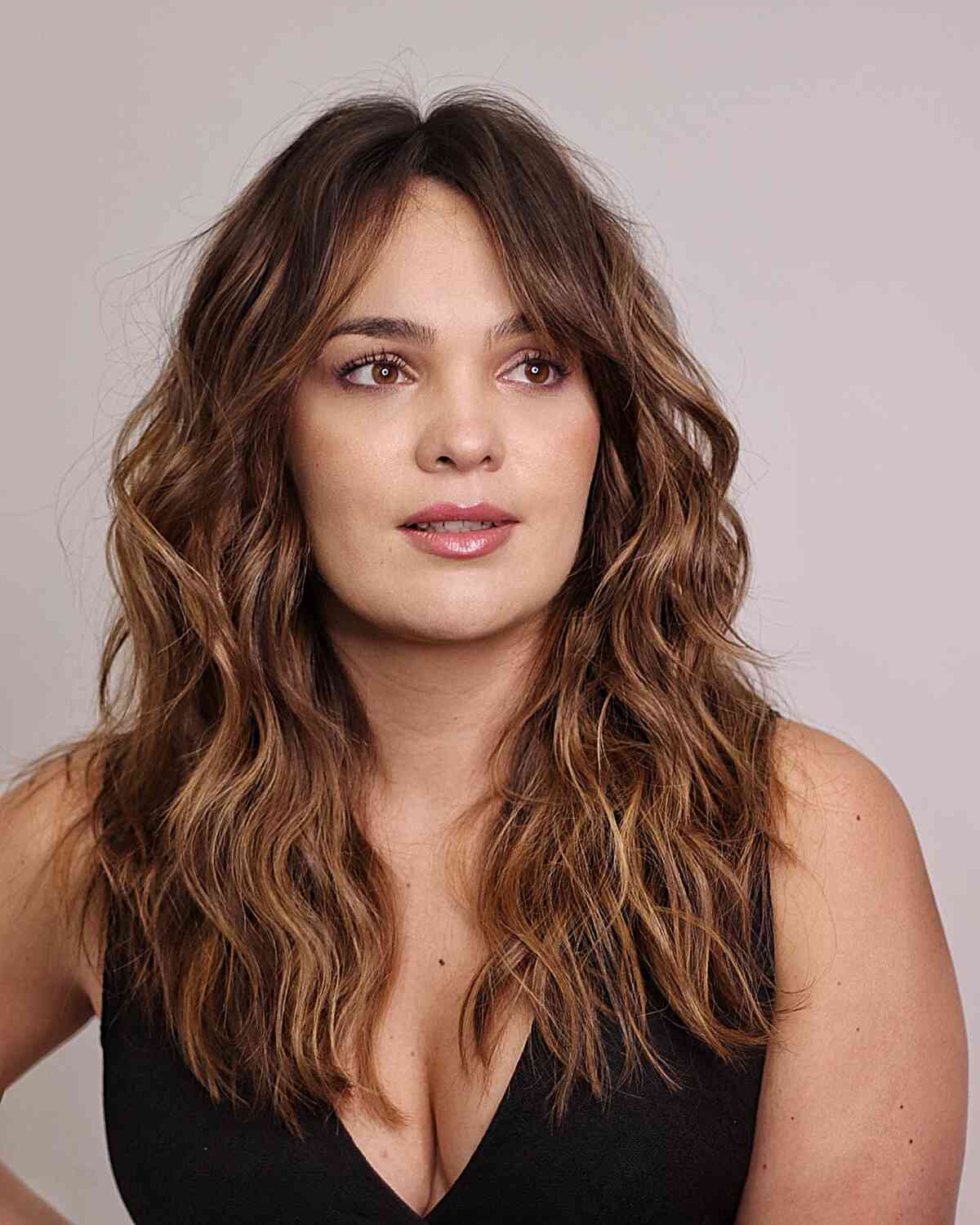 Mid-Length Wavy Curls for Square Face Shapes