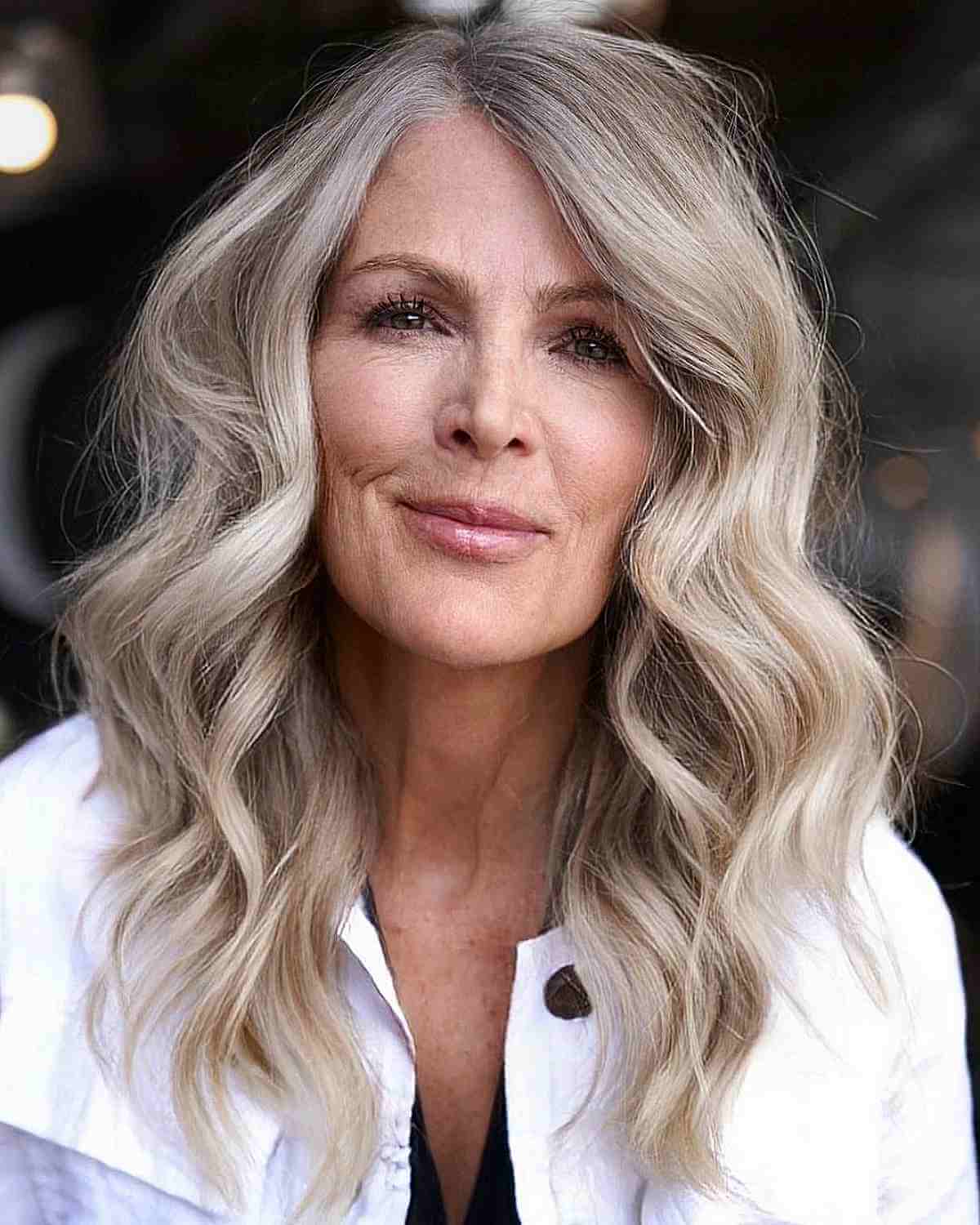 Mid-Length Wavy Hair with a Side Part for 60-Year-Old Ladies