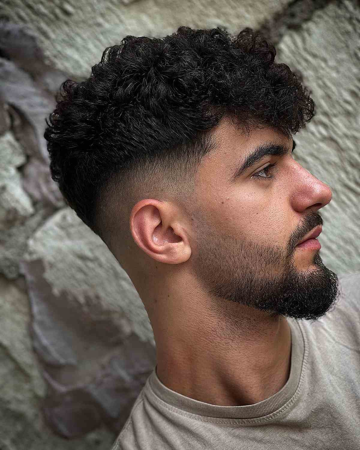 Mid Skin Fade with Dense Curls for Men
