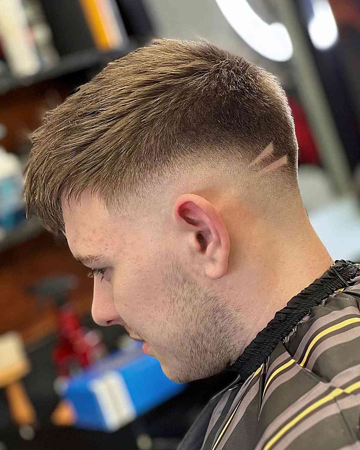 Mid Skin Fade with Shaved Hair Design and Choppy Texture for Fine Locks
