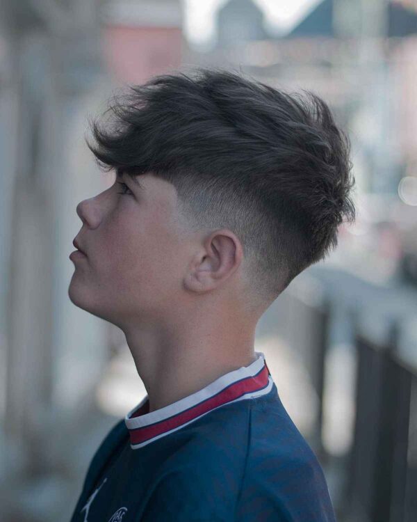 A Mid Taper Fade with a Long Top for Teenage Boys