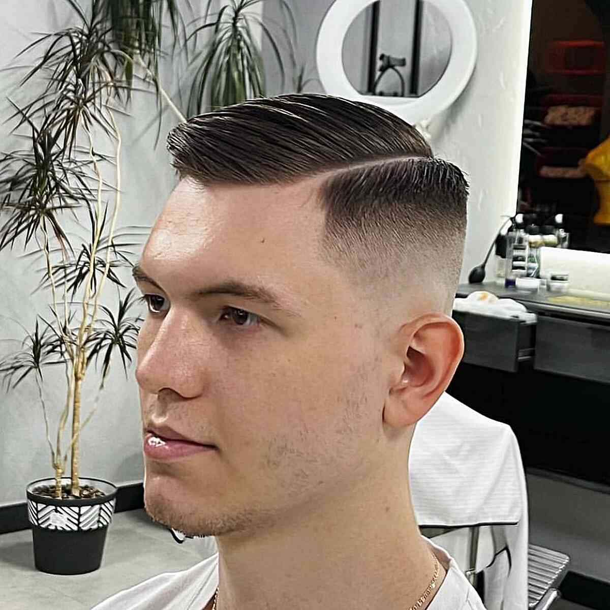 Military-Style Hard Part with a Skin Fade and Combover for Men