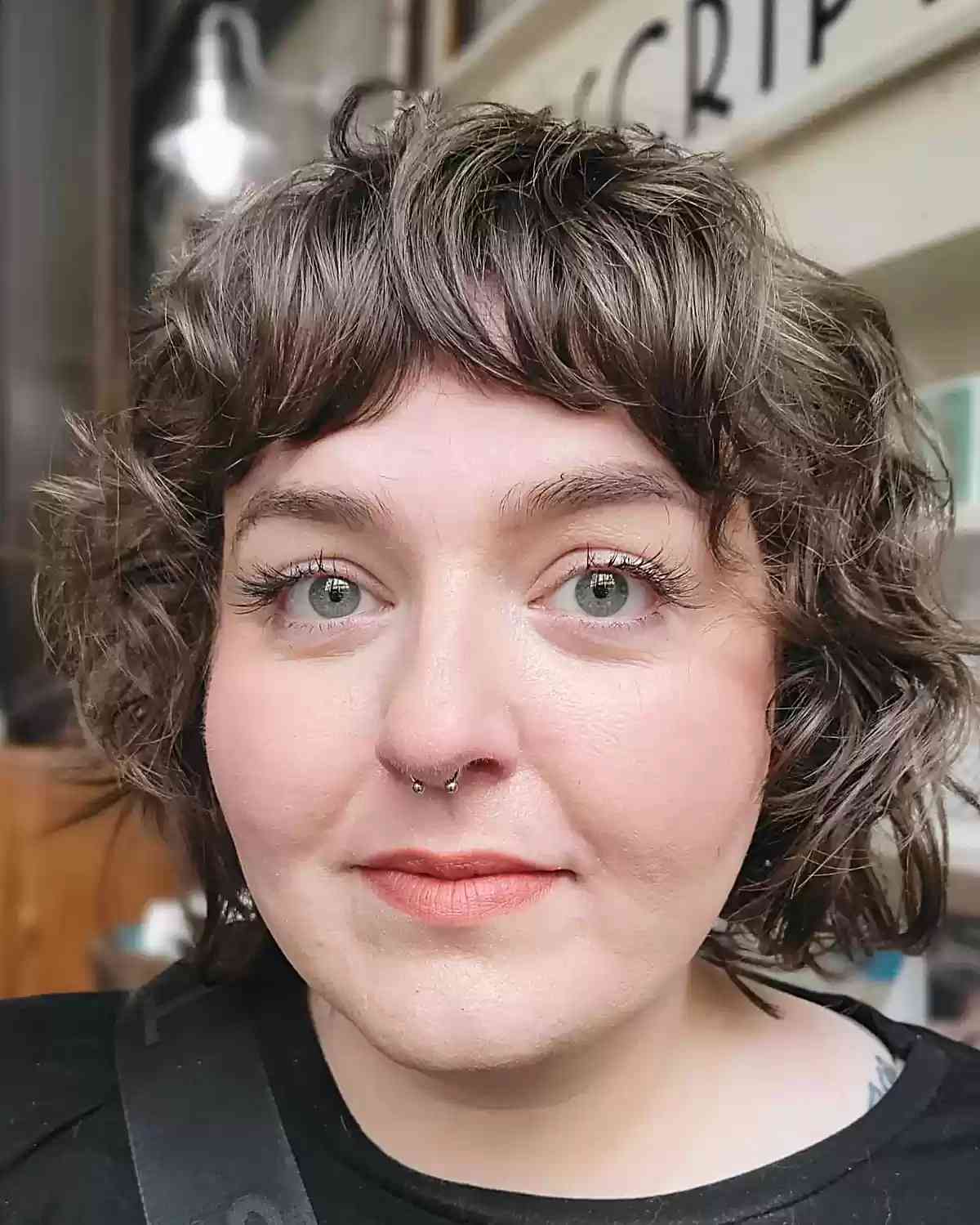 Jaw-Grazing Mini Curly Bob and Bangs for chubbier faces