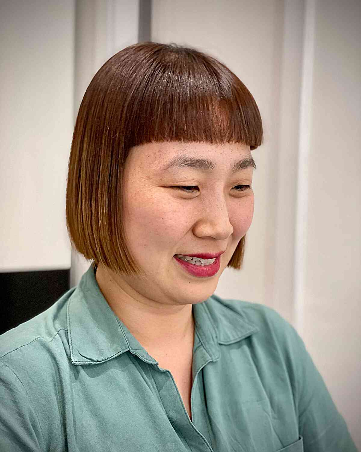 Mini Sleek Bob with Blunt Bangs for Asian Women with Fuller Faces