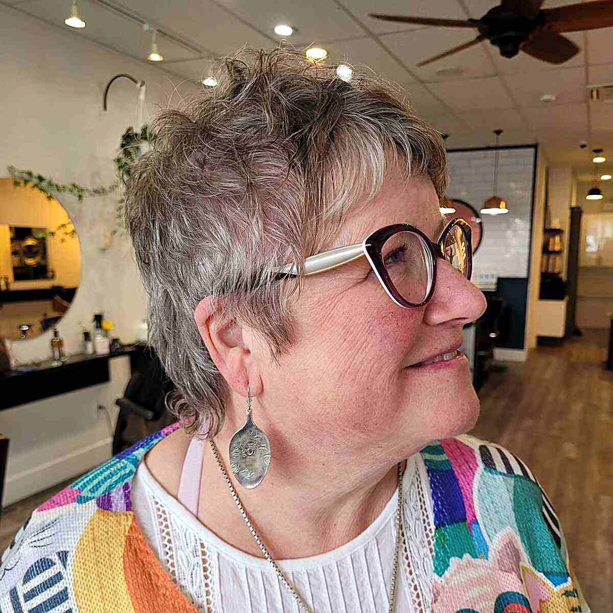 Mixie Cut with Feathered Bangs and Layers for ladies in their 60s