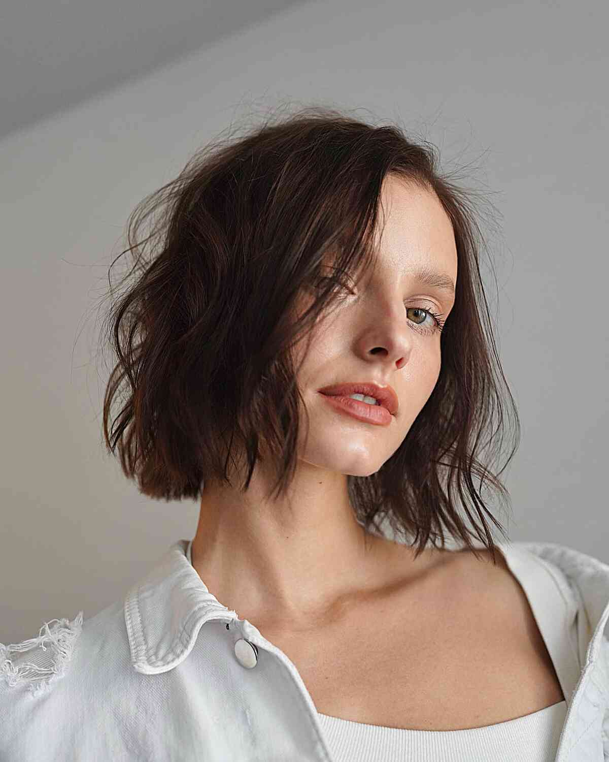 Modern and Soft Blunt Cut Bob for women in their 30s with short straight hair