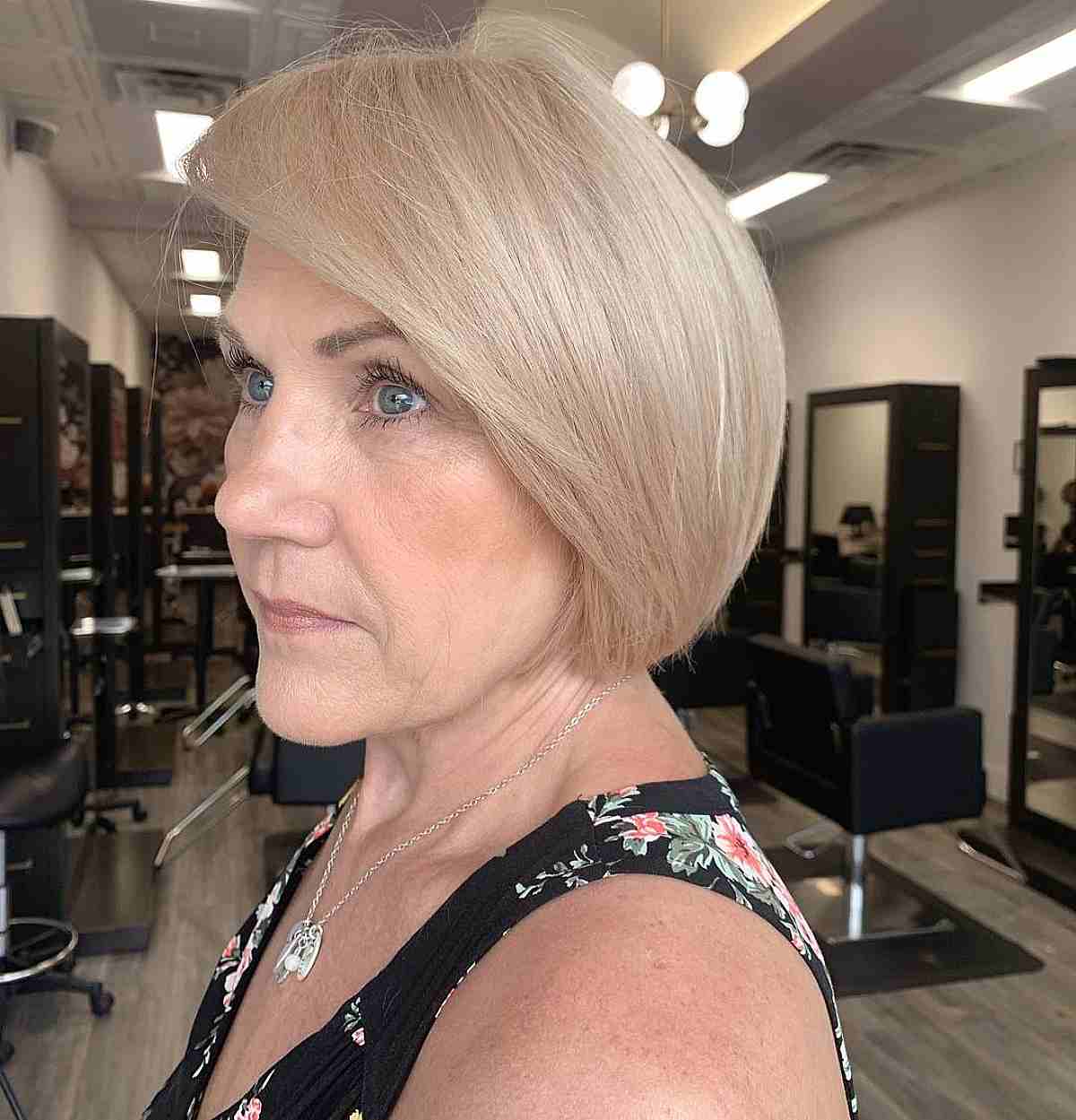 Modern Round Bob with Long Side Bangs for Fifty-Year-Old Women
