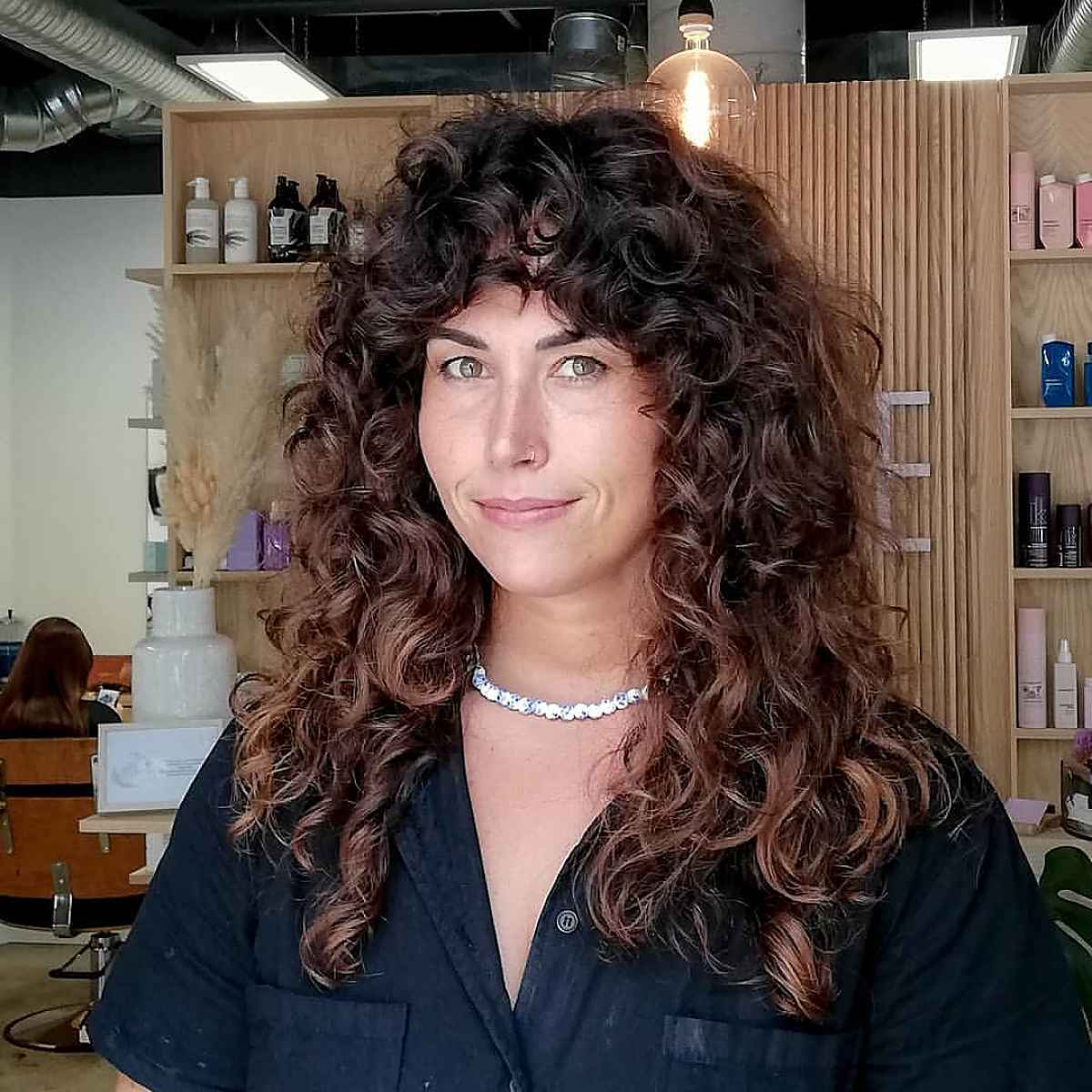 Modern Shagged Curls with Thick Bangs