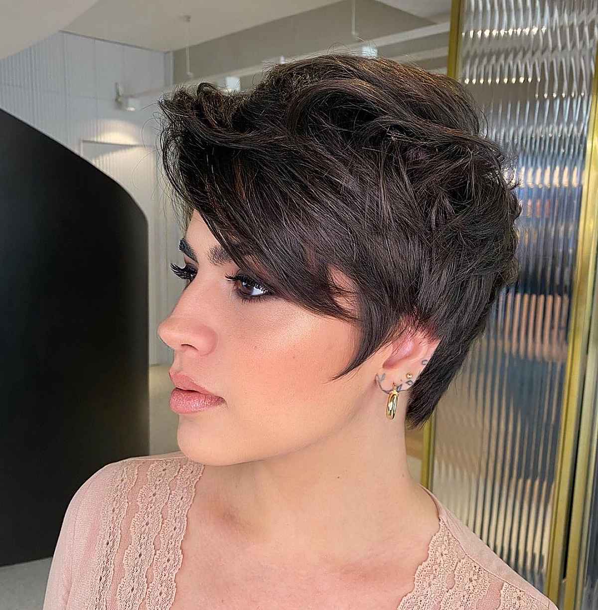 modern shaggy pixie with long side swept bangs