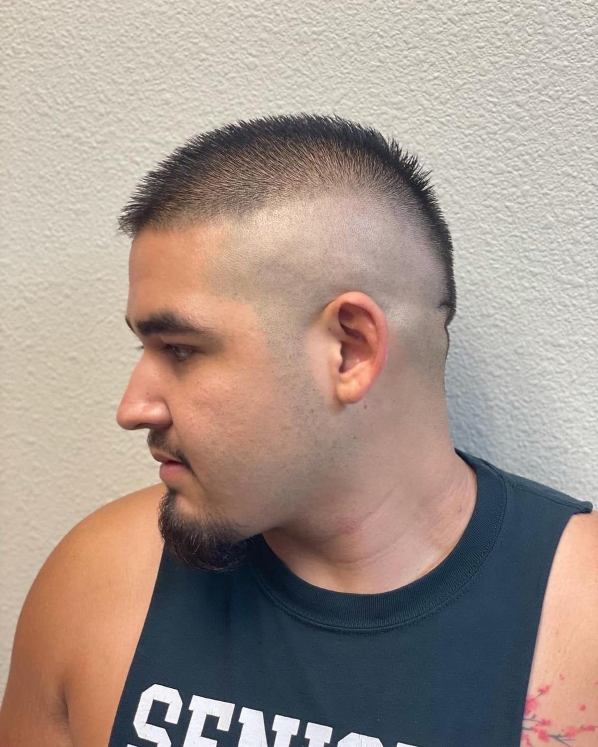 Trendy Mohawk-inspired buzz cut for guys