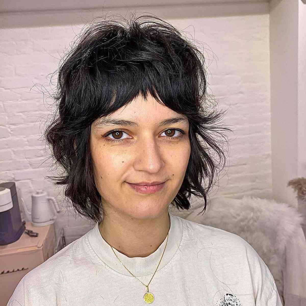Short 1970s Razored Bob Haircut with Shag Bangs