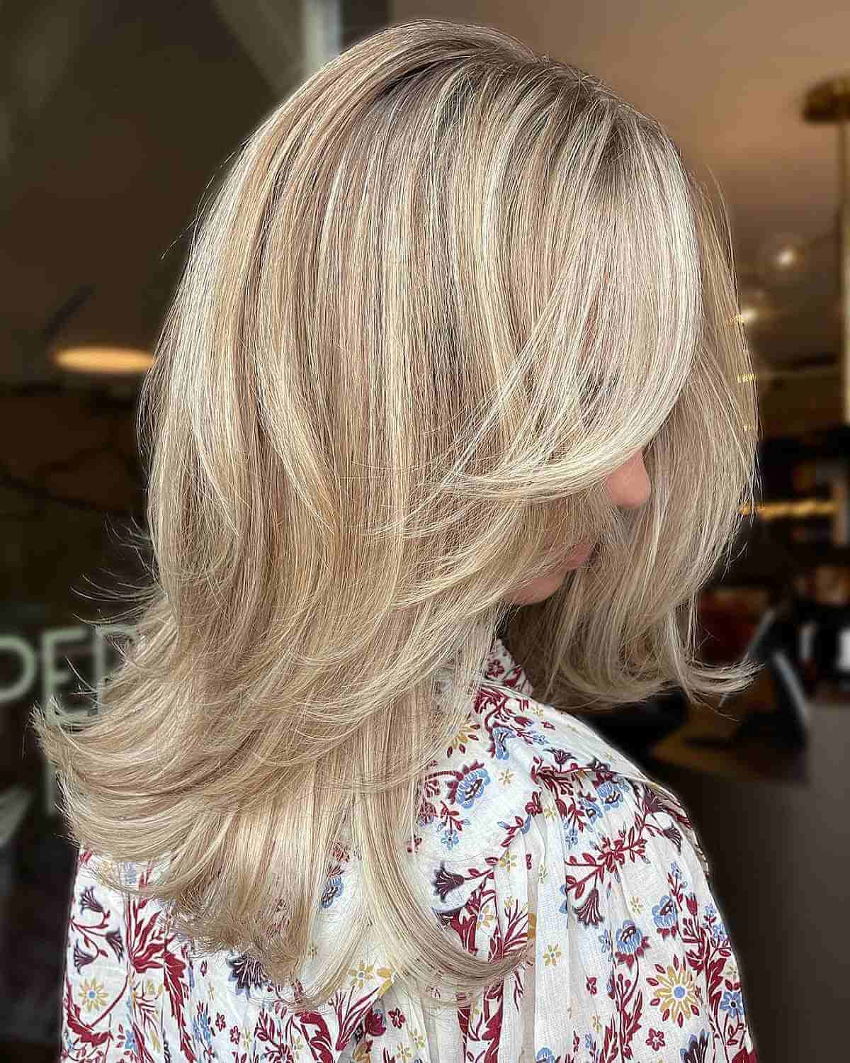 Adorable Medium Butterfly Layered Haircut Featuring Blonde Balayage