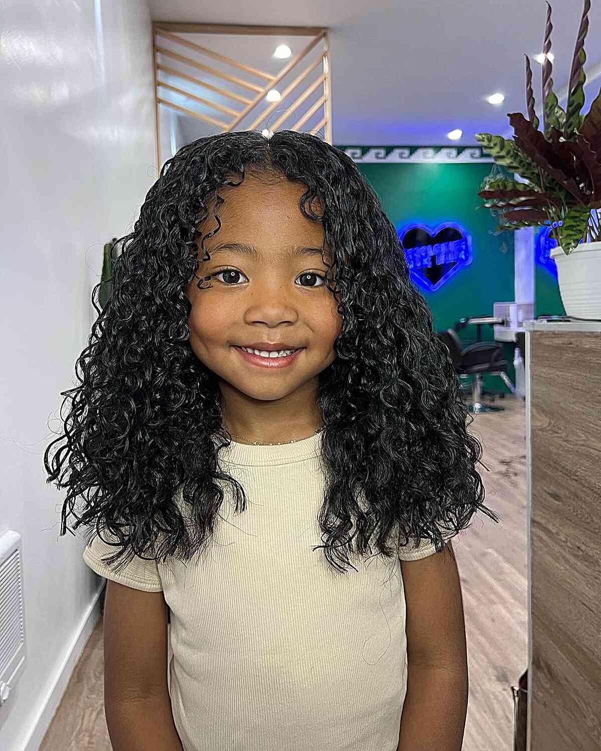 Adorable loose curls for black girls with medium-length hair