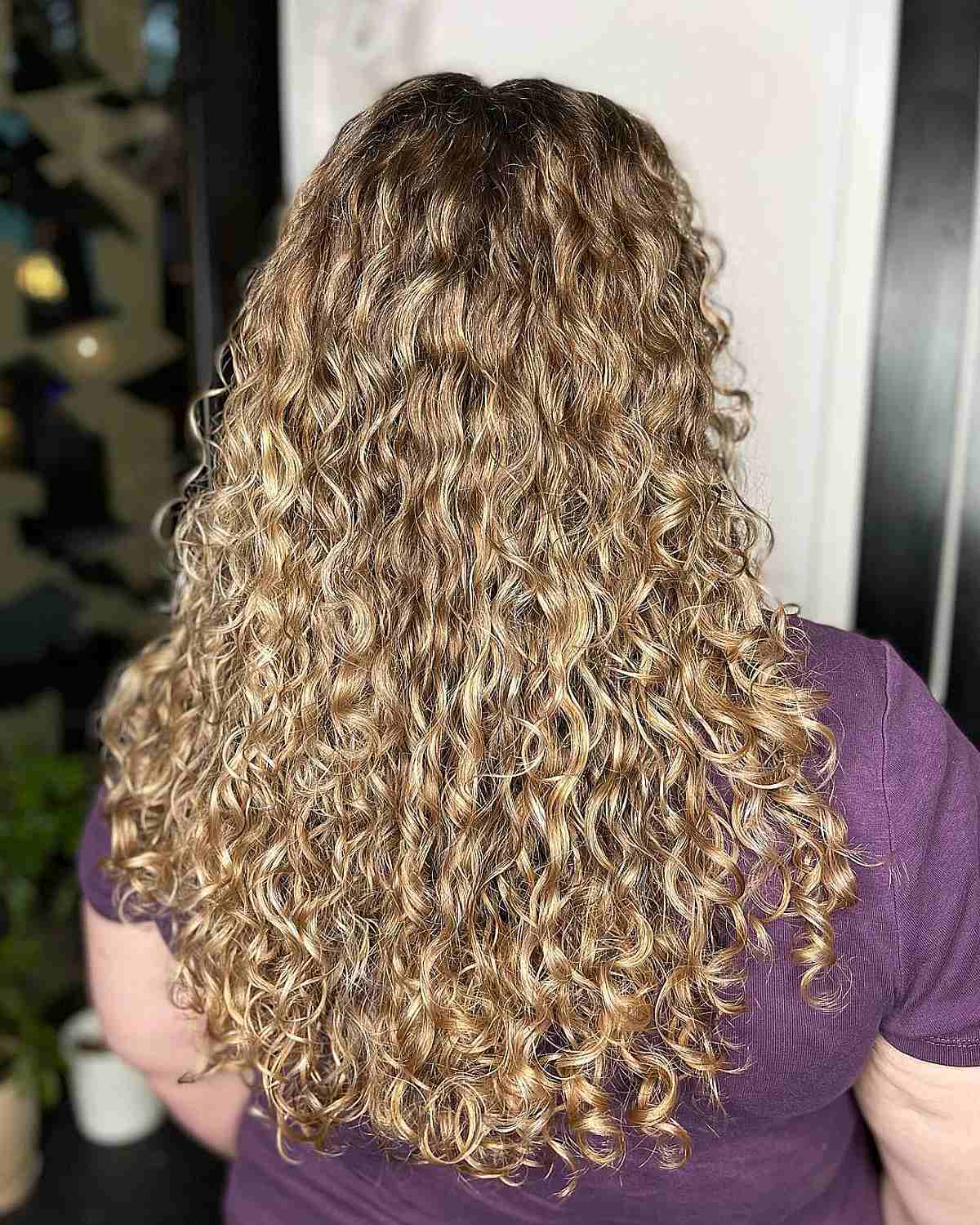 Artfully Painted Honey Blonde Balayage with Flowing Curls