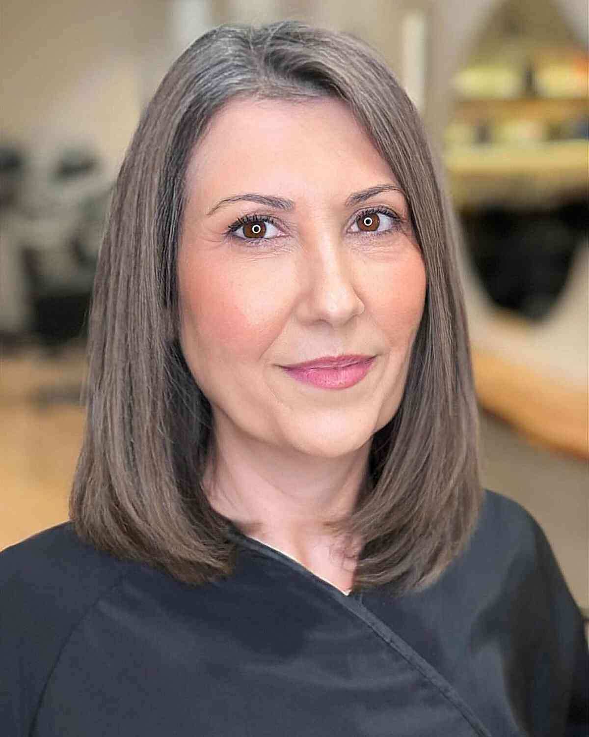 Effortless Ash Brown Long Bob Hairstyle for Women over 50