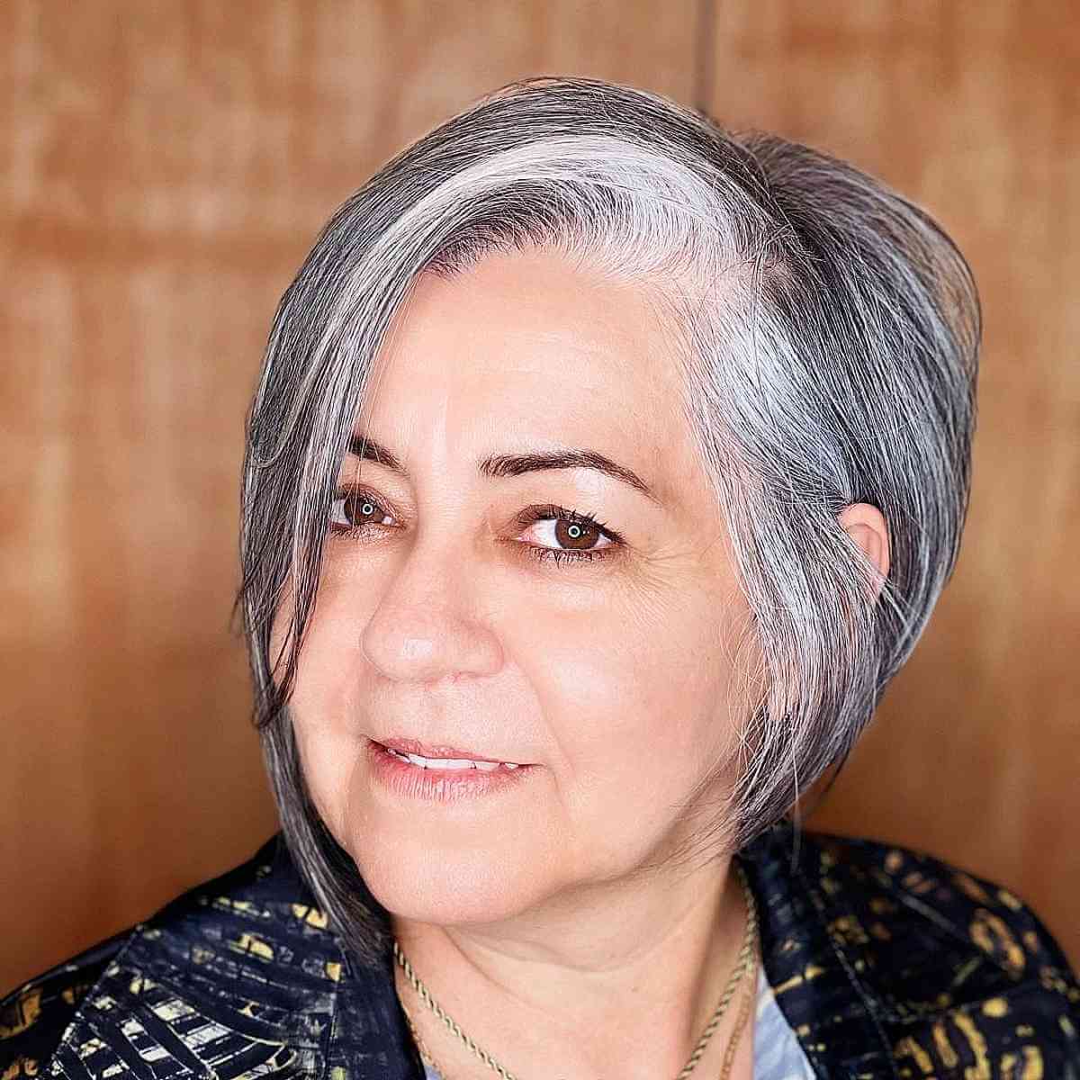Asymmetrical Bob Featuring a Side Part for Fine-Haired Individuals in Their Fifties