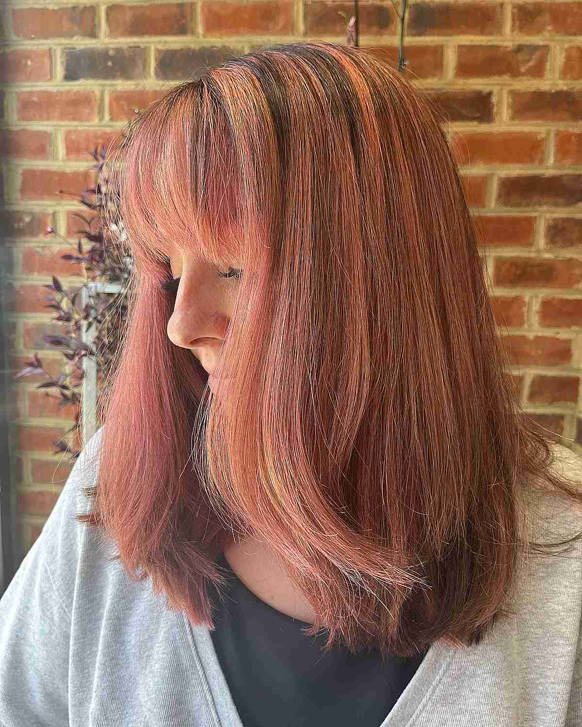 Balayage Hair in Rose Gold and Auburn with Bangs