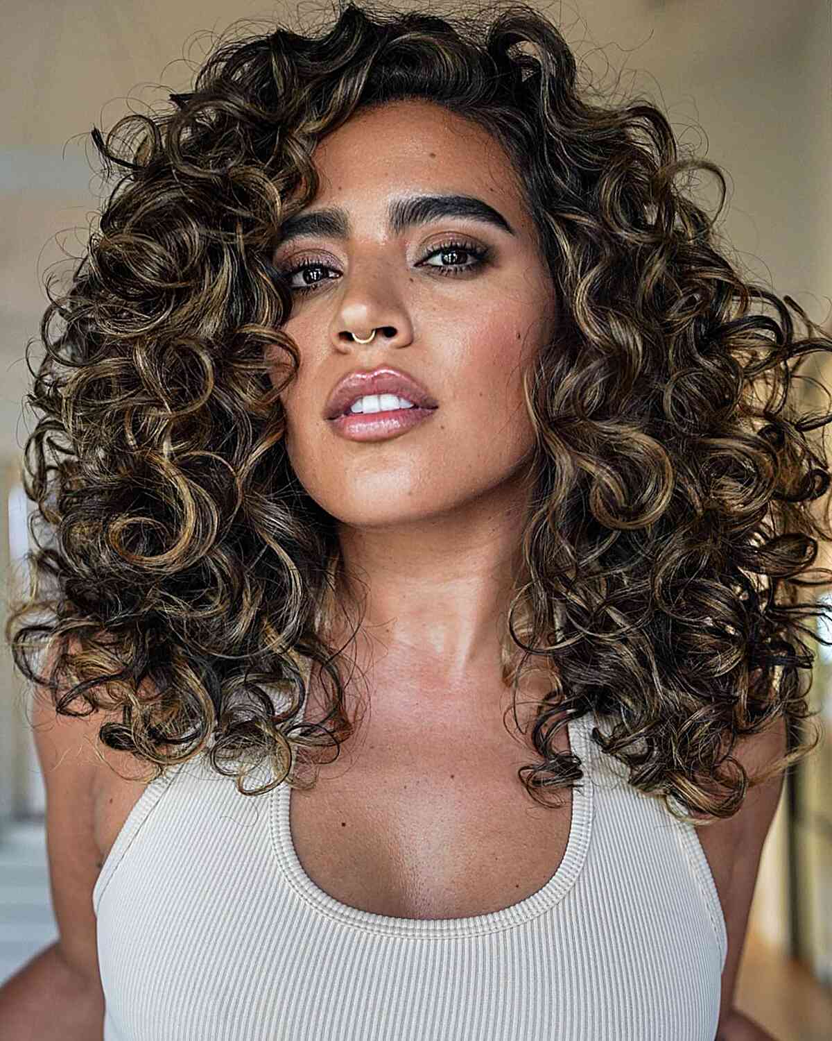 Balayaged Curls with a Rezo Cut for women featuring long hair