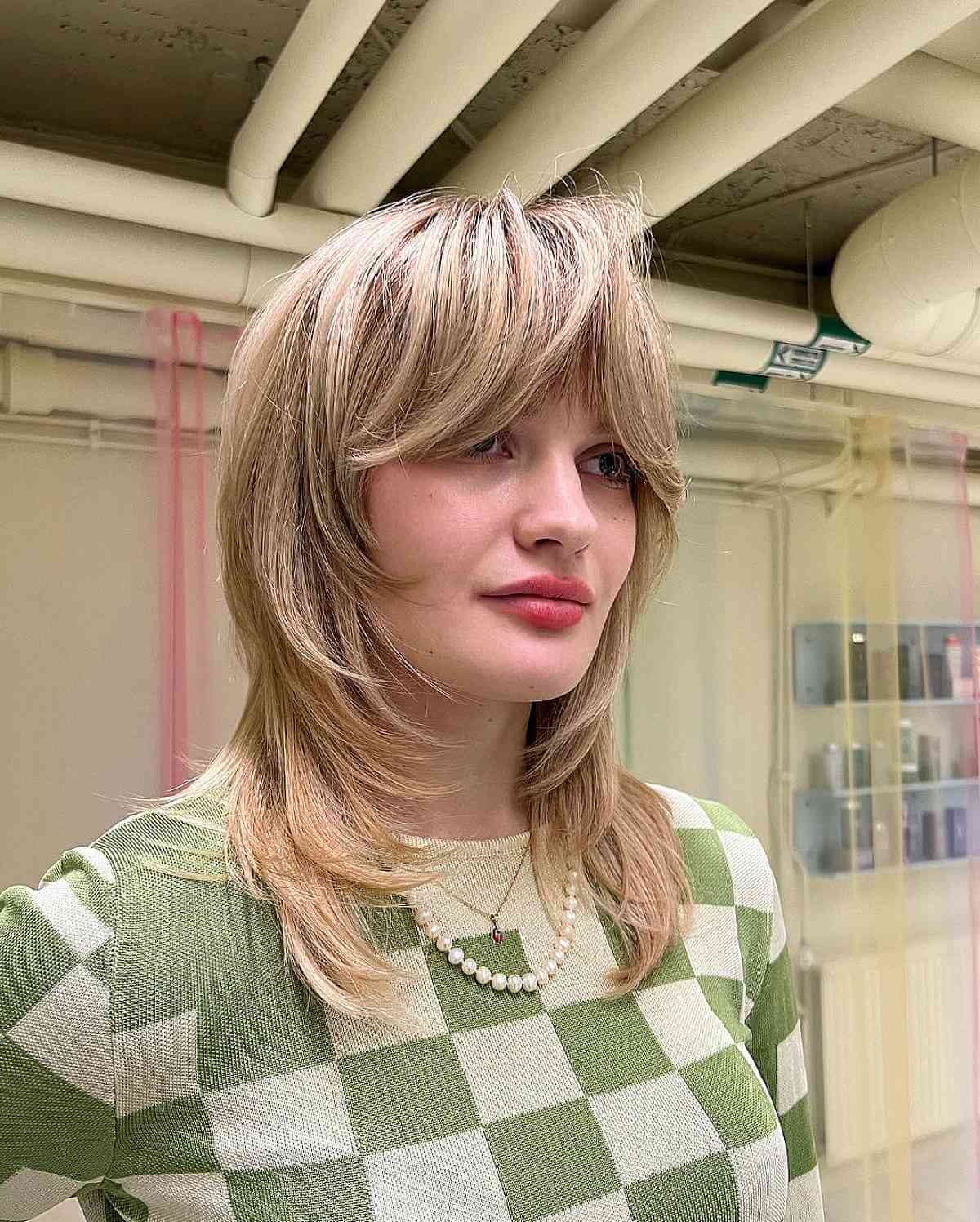 Bangs that Frame the Face on a Mid-Length Layered Hairstyle